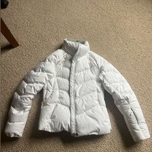 Nike women’s puffer coat, white with gray lining. New without tags. Medium